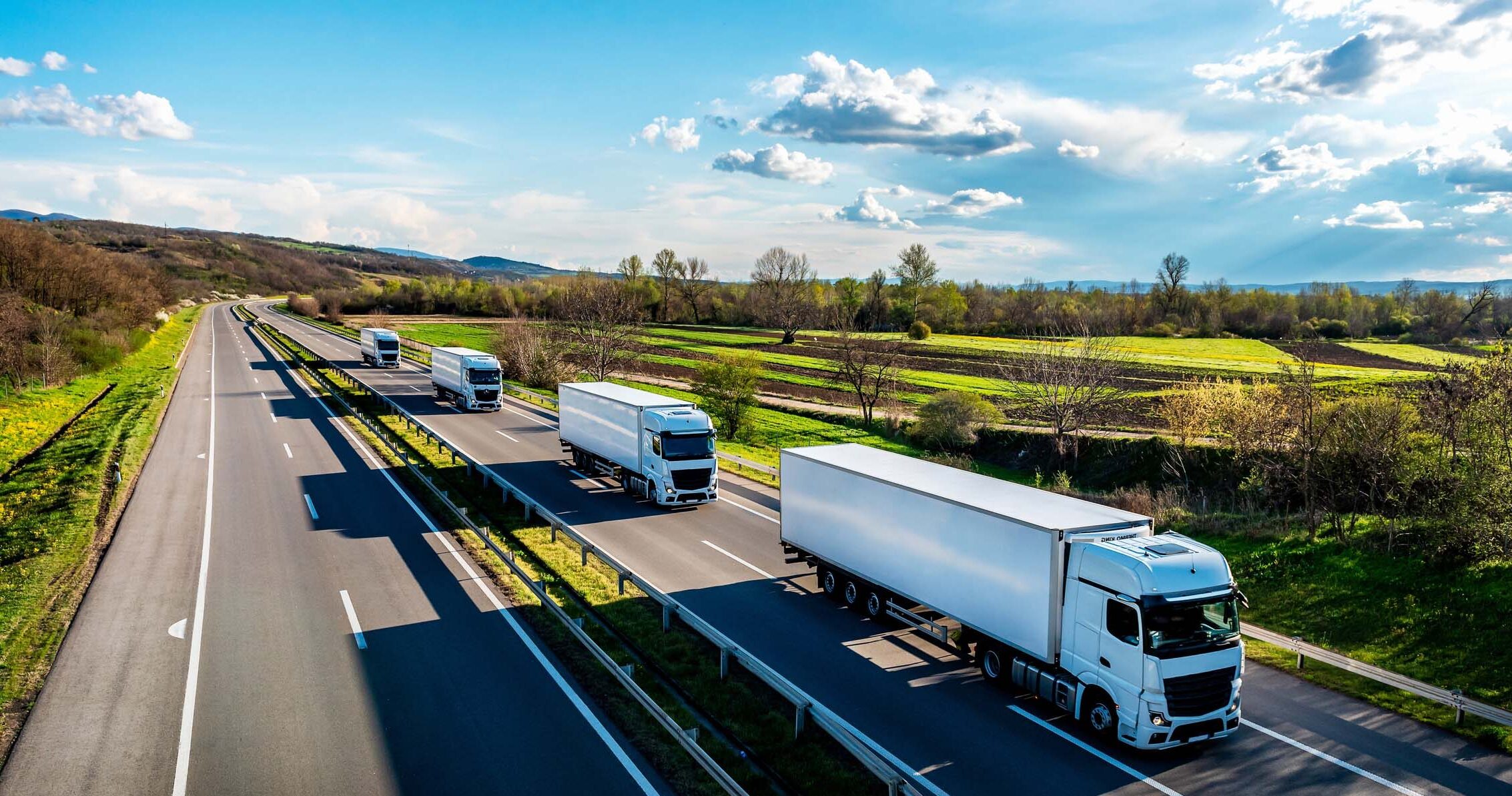 White Trucks with containers on highway